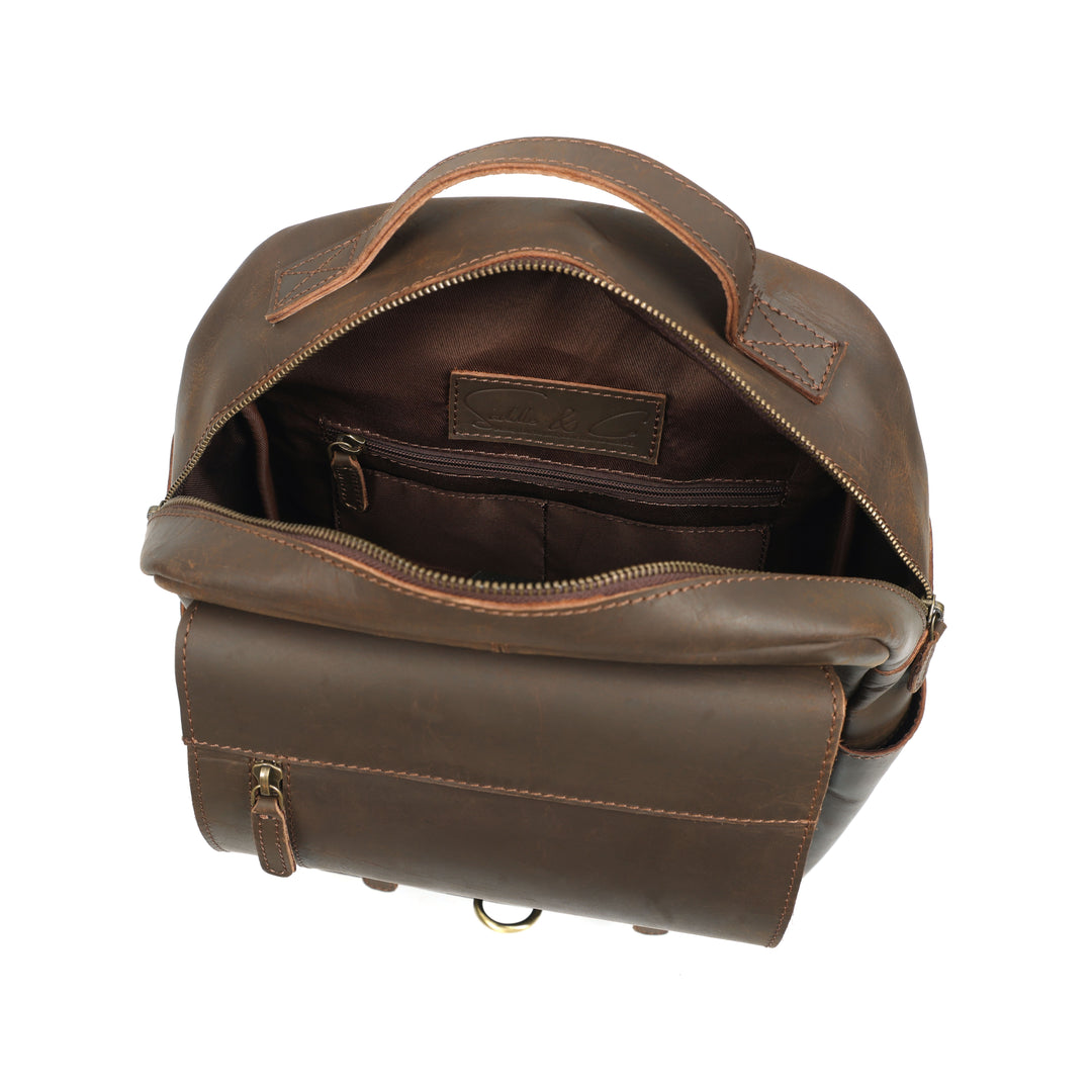 Brown leather backpack on a white background