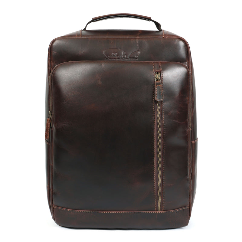 Brown leather backpack on a white background