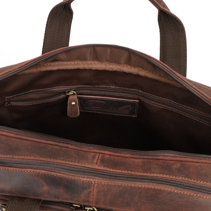 Brown leather bag with visible brand logo on a white background