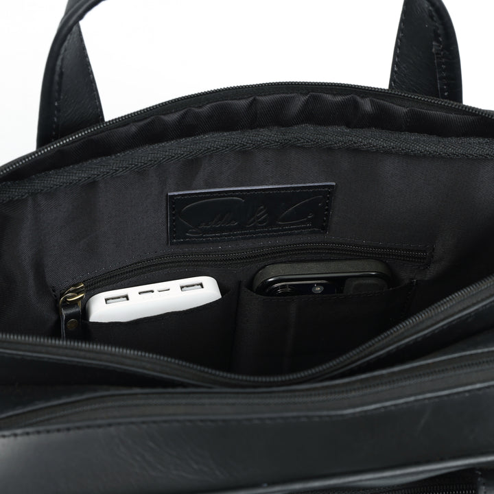 Black bag with USB ports and charging cable inside