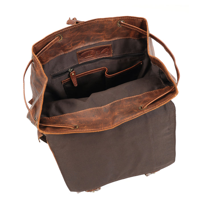 Brown leather bag with a visible brand label on a white background