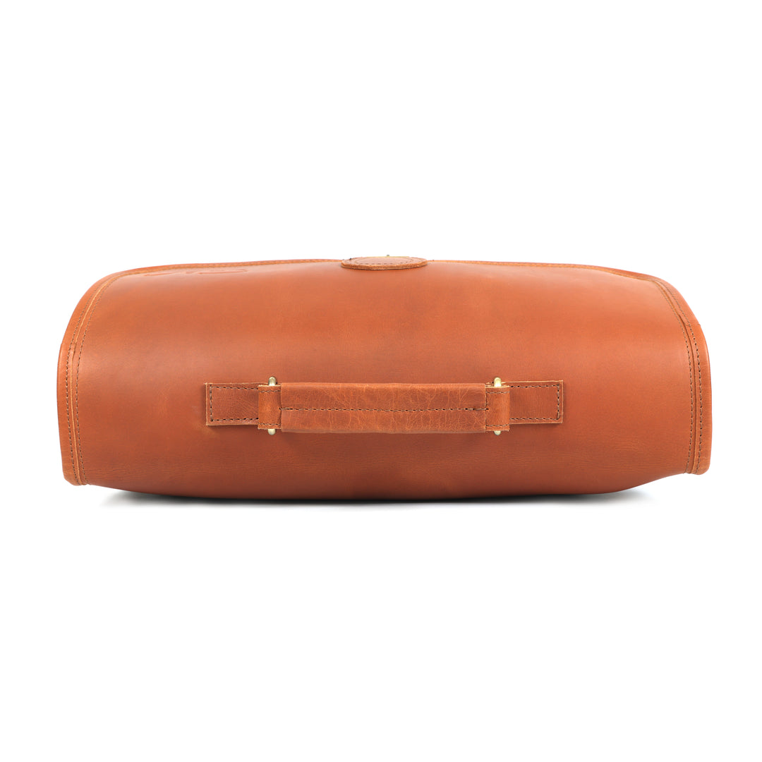 Brown leather cylindrical bag with a handle on a white background