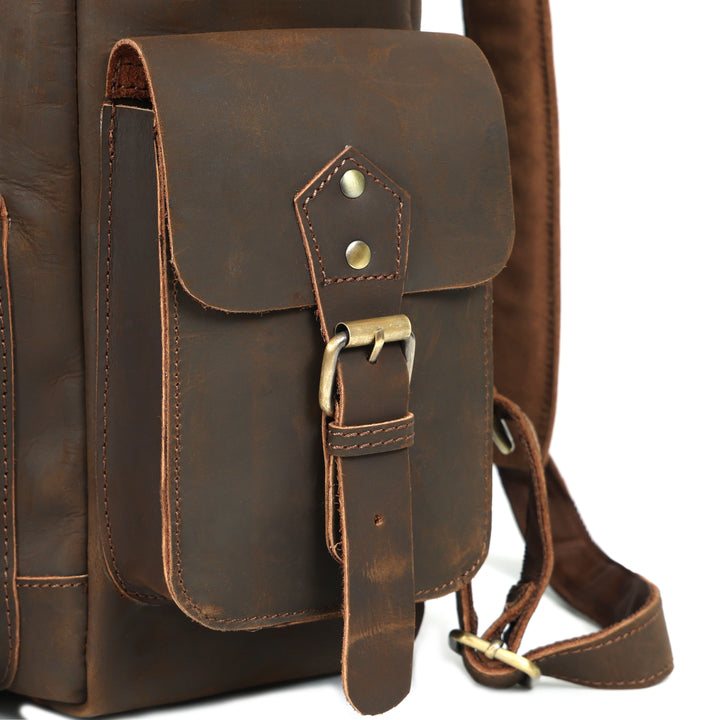 Brown leather backpack with gold hardware on a white background