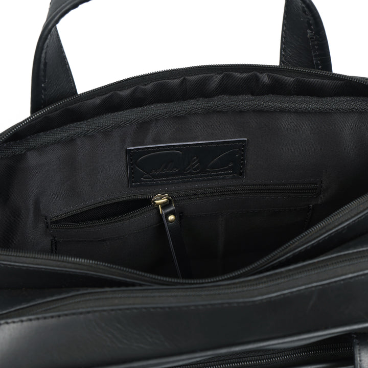 Close-up of a black backpack with a visible brand logo on a white background