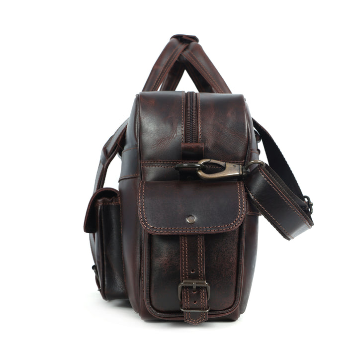 Brown leather bag with a strap on a white background