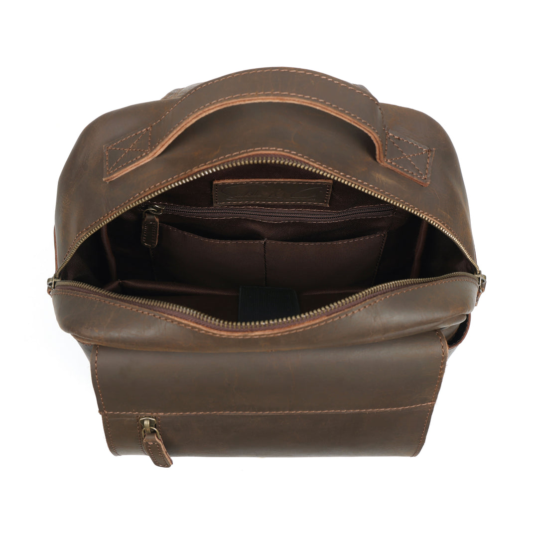 Brown leather bag with open top on a white background