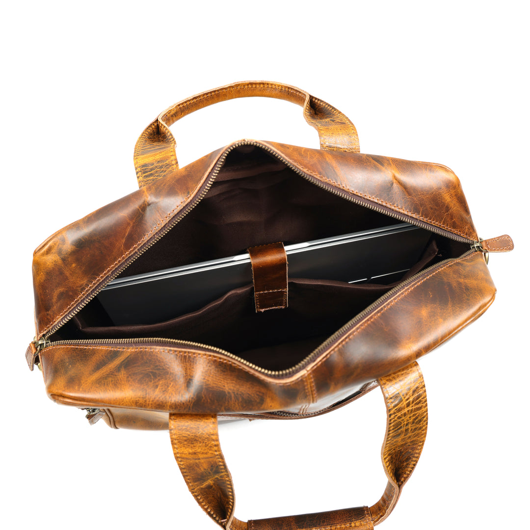 Brown leather backpack with a laptop inside on a white background