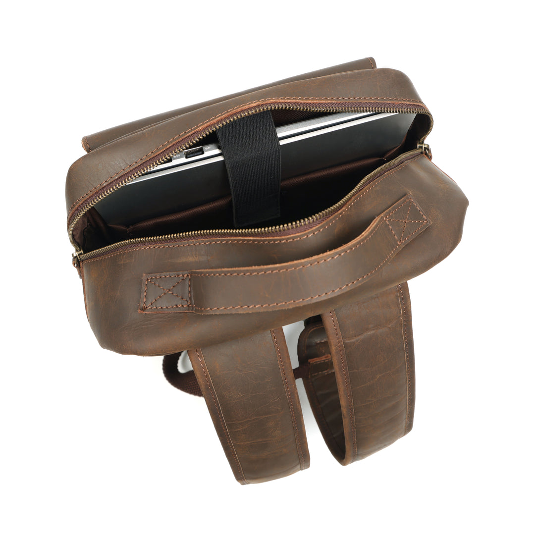 Brown leather bag with a zipper on a white background