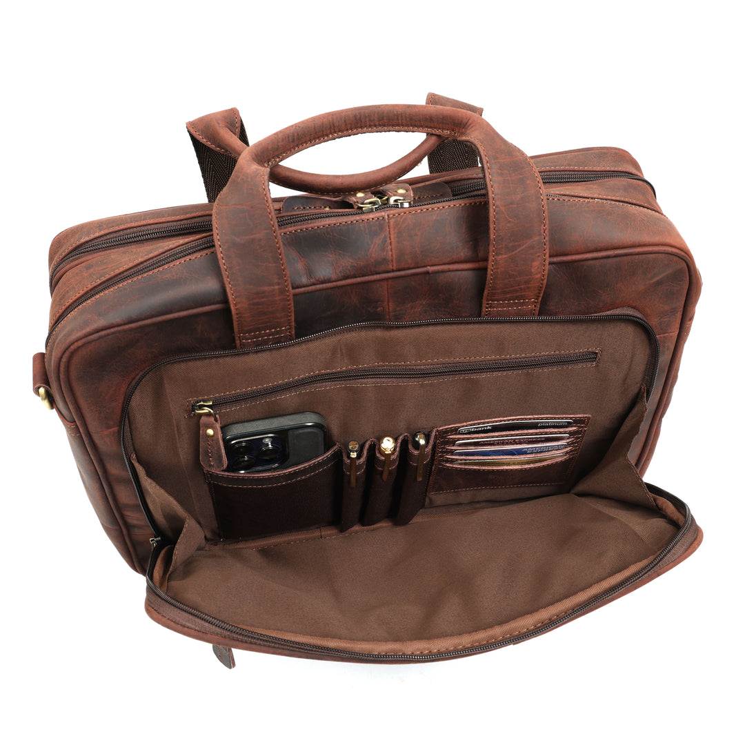 Brown leather briefcase with multiple pockets on a white background