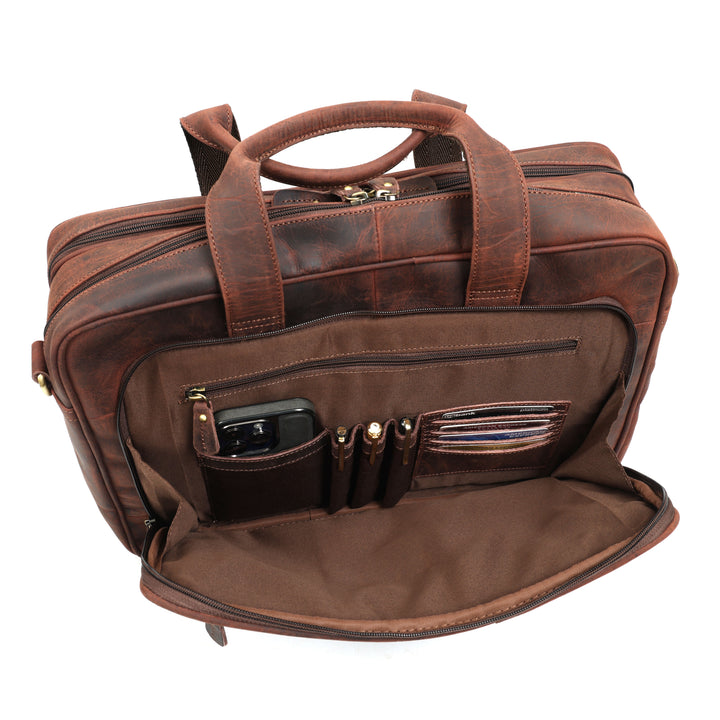 Brown leather briefcase with multiple pockets on a white background