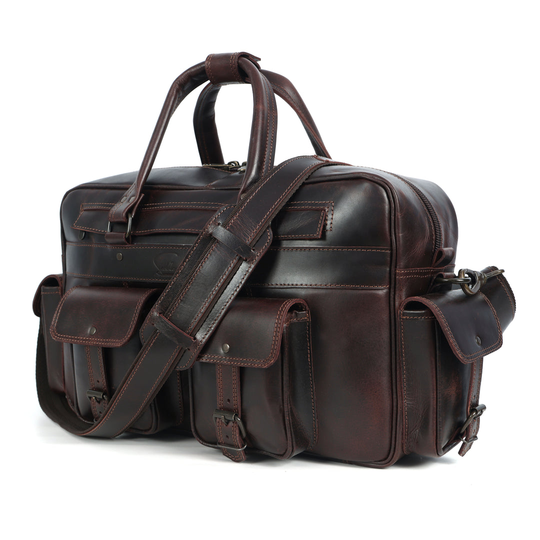 Brown leather briefcase with shoulder strap on a white background