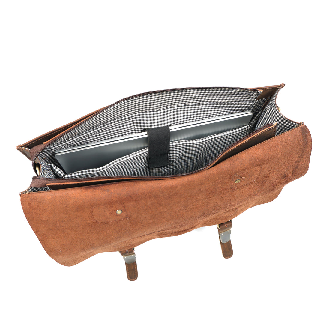 Brown leather bag with a gingham lining on a white background