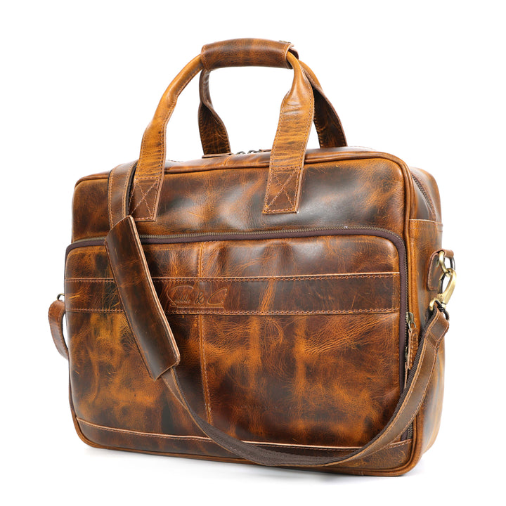 Brown leather briefcase with shoulder strap on a white background