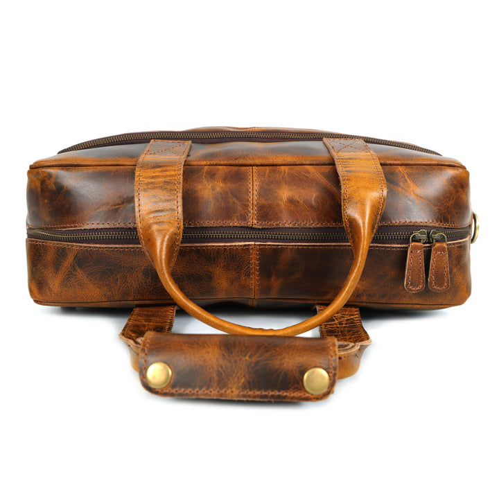 Brown leather duffel bag on a white background