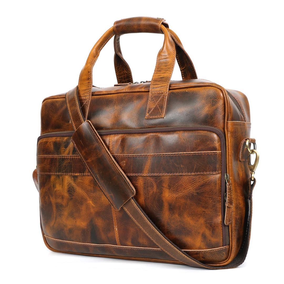 Brown leather briefcase with shoulder strap on a white background