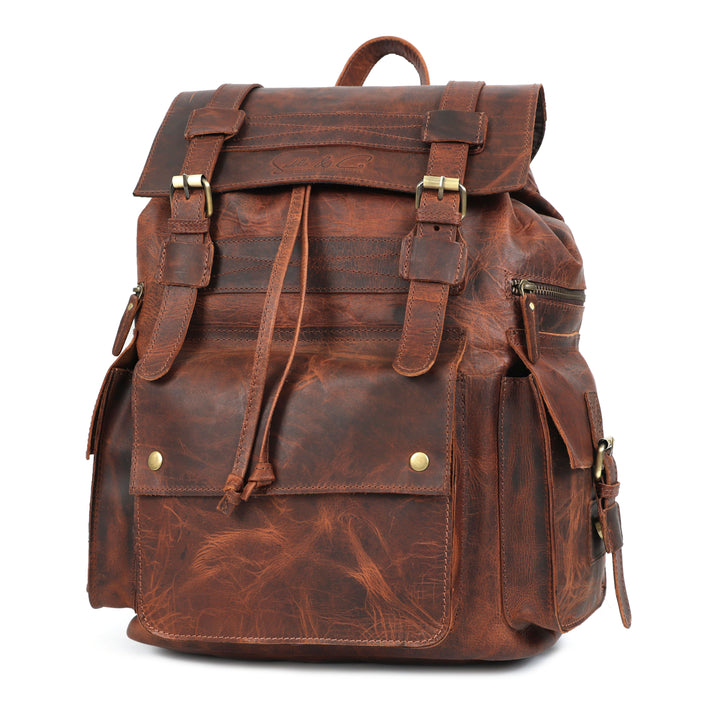 Brown leather backpack with gold buckles on a white background