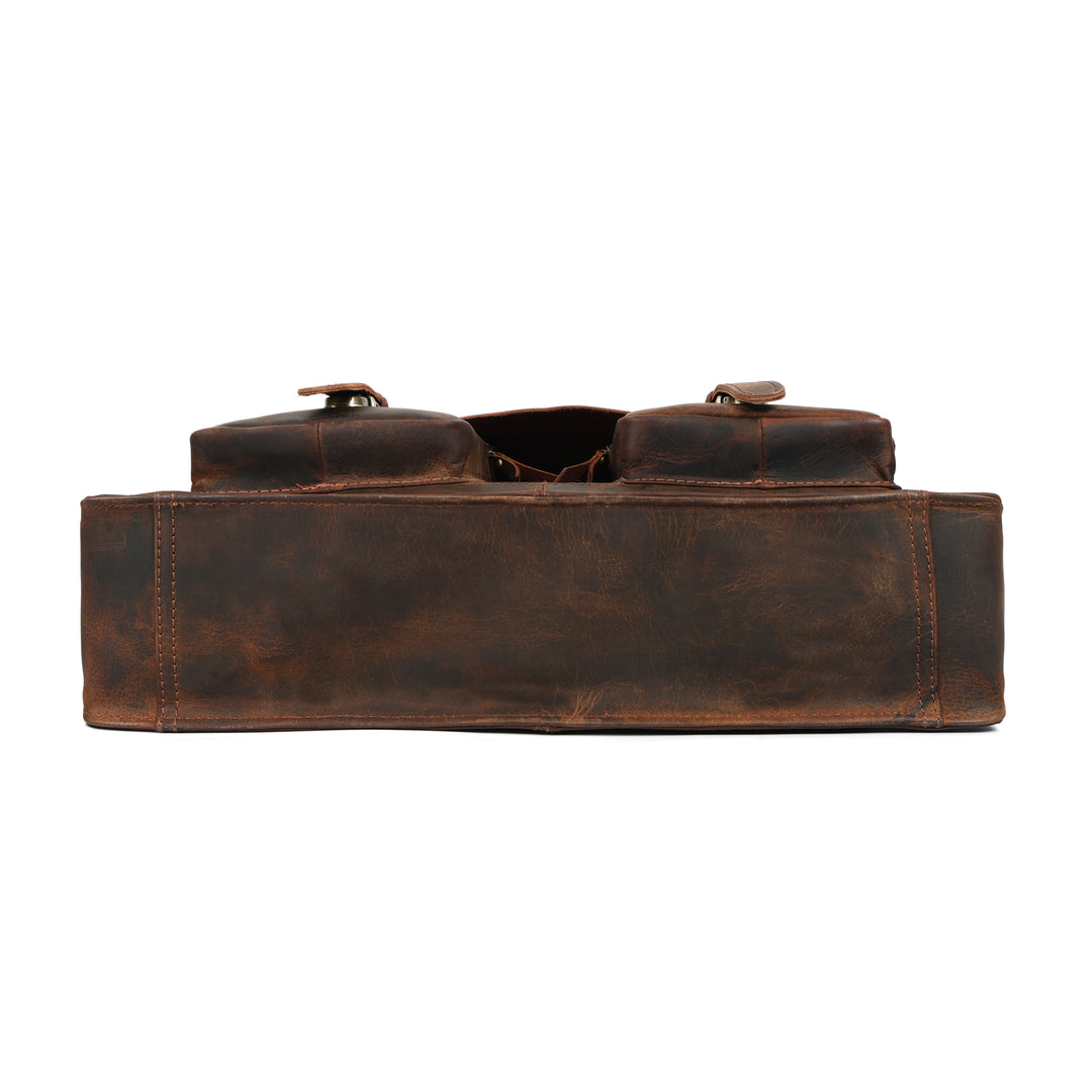 Brown leather bag with a strap on a white background