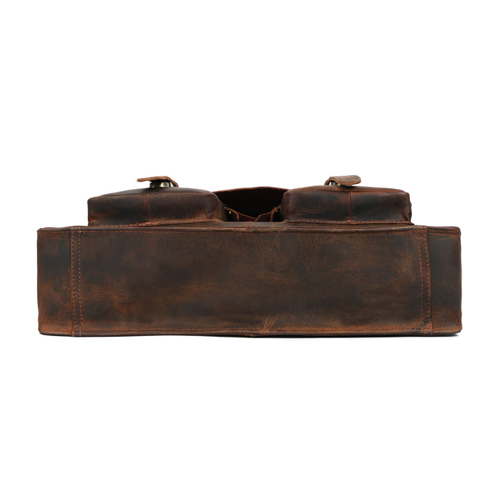 Brown leather bag with a strap on a white background