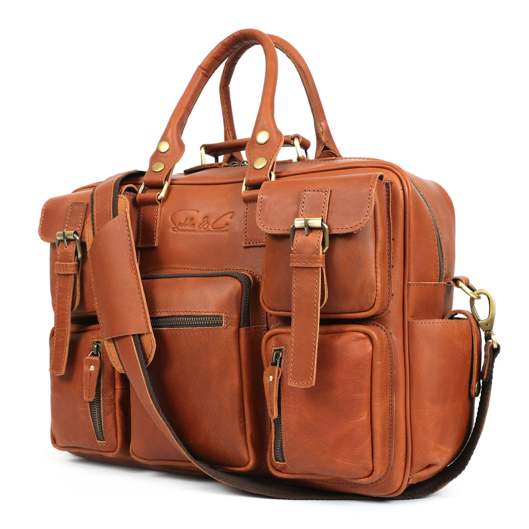 Brown leather briefcase with multiple pockets and straps on a white background