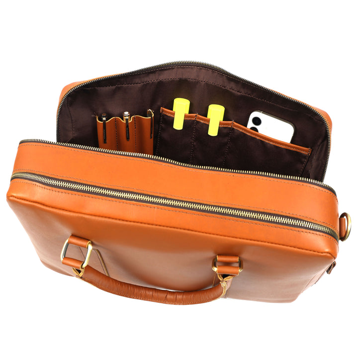 Close-up of a brown leather bag with a buckle on a white background