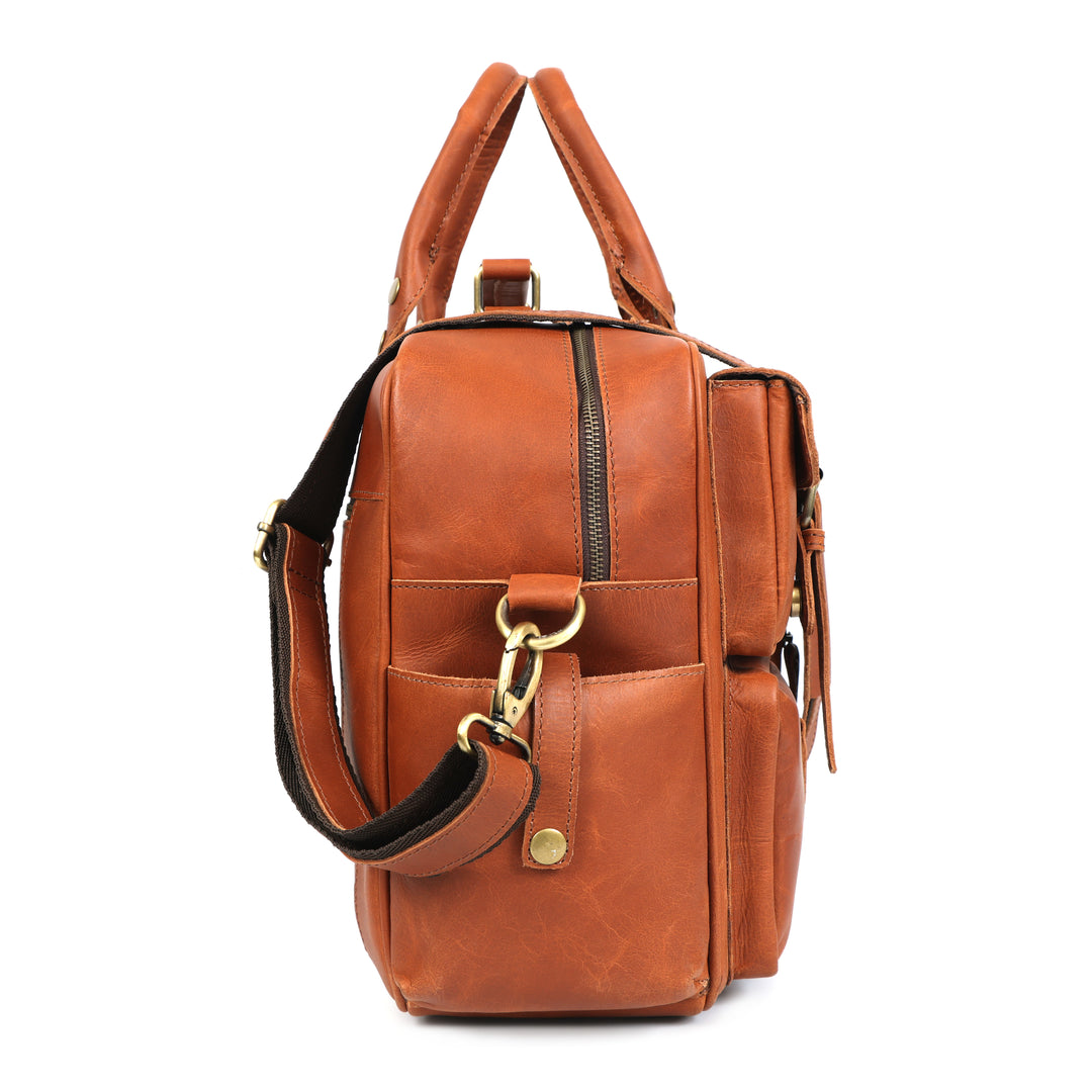 Brown leather backpack with gold accents on a white background