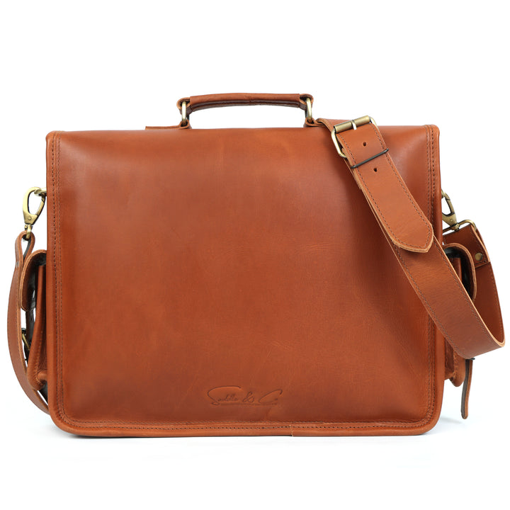 Brown leather satchel bag with a shoulder strap on a white background