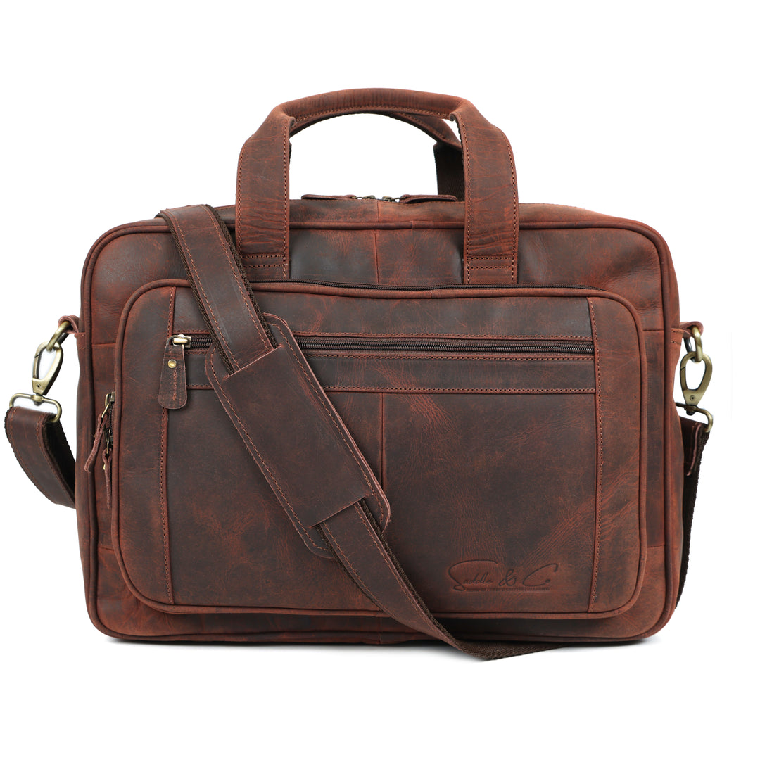 Brown leather briefcase with shoulder strap on a white background