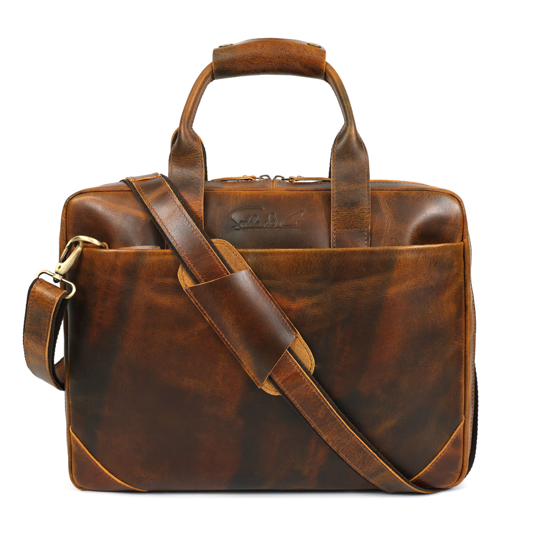 Brown leather briefcase with shoulder strap on a white background