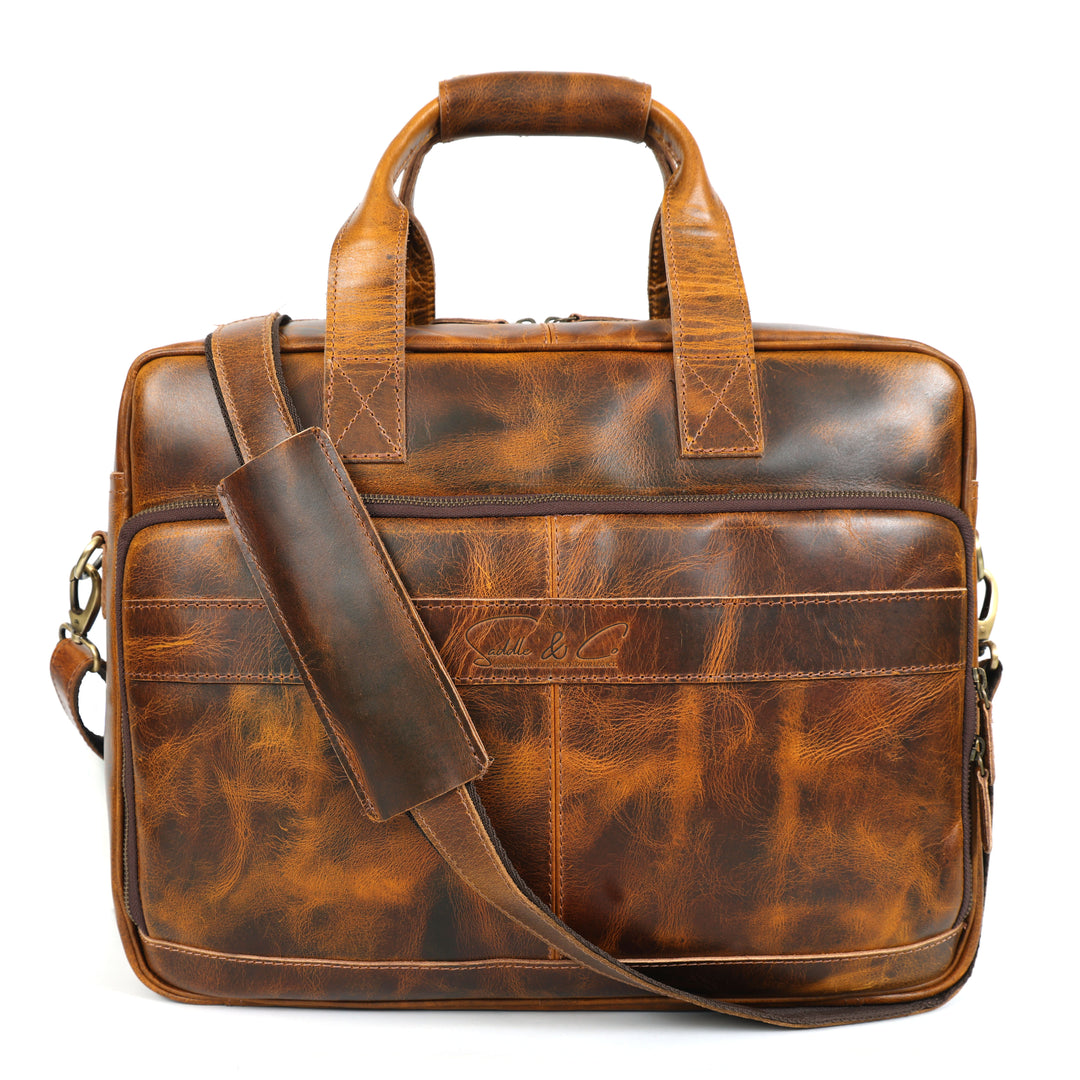 Brown leather briefcase with shoulder strap on a white background