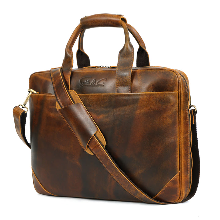 Brown leather briefcase with shoulder strap on a white background