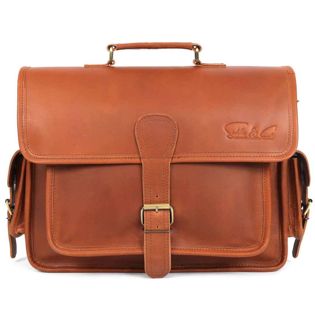 Brown leather satchel bag with a strap on a white background