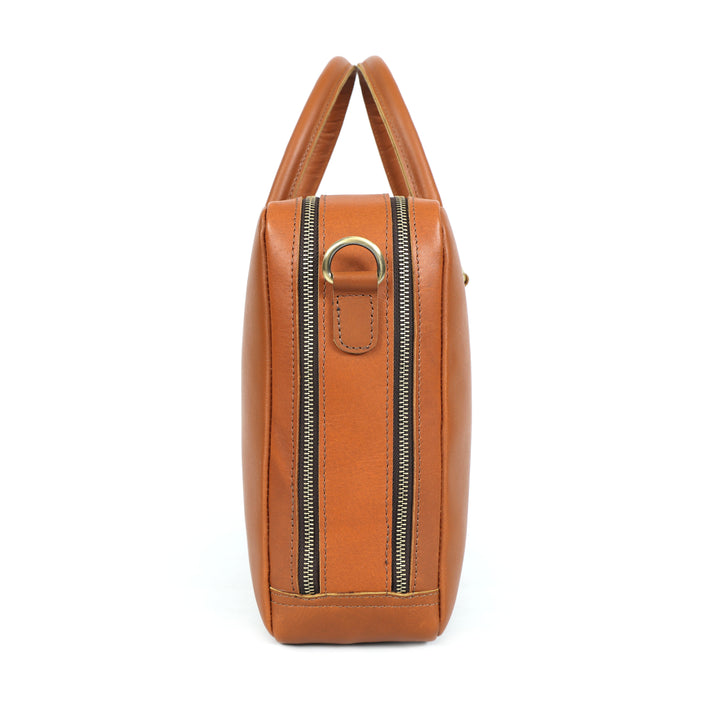 Close-up of a brown leather bag with 'Saddle & Co.' branding.