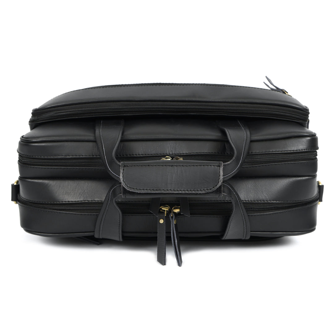 Black leather briefcase with multiple compartments on a white background
