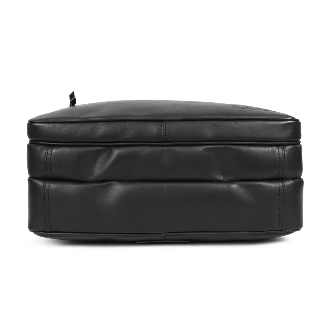 Black leather ottoman on a white background