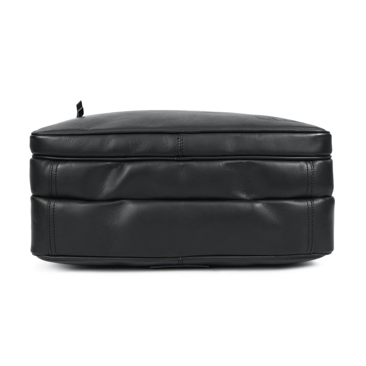 Black leather ottoman on a white background
