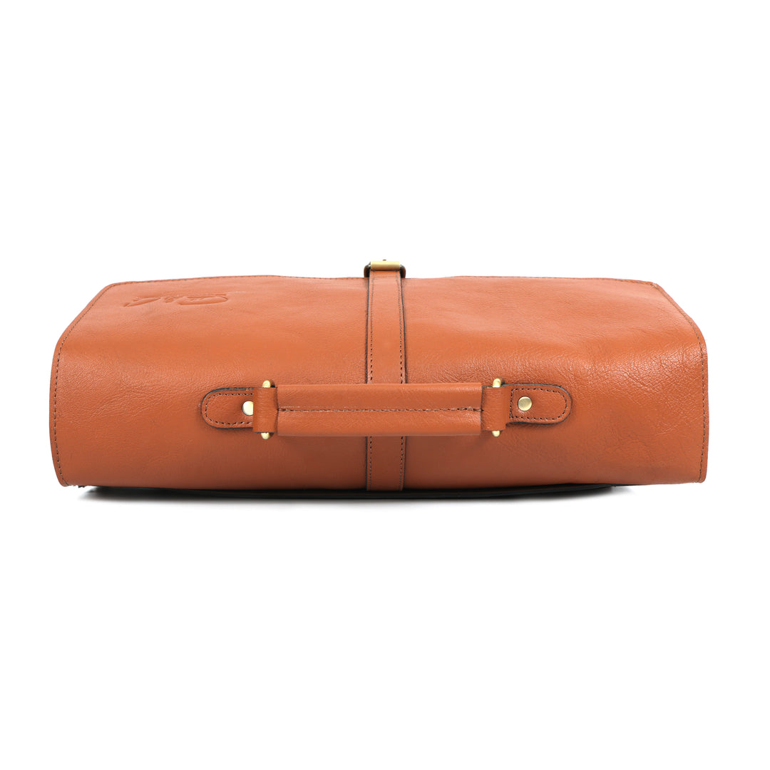 Brown leather travel roll with gold hardware on a white background