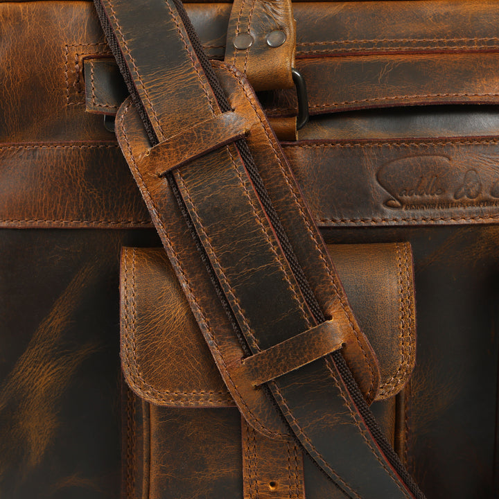 Close-up of a brown leather bag with strap