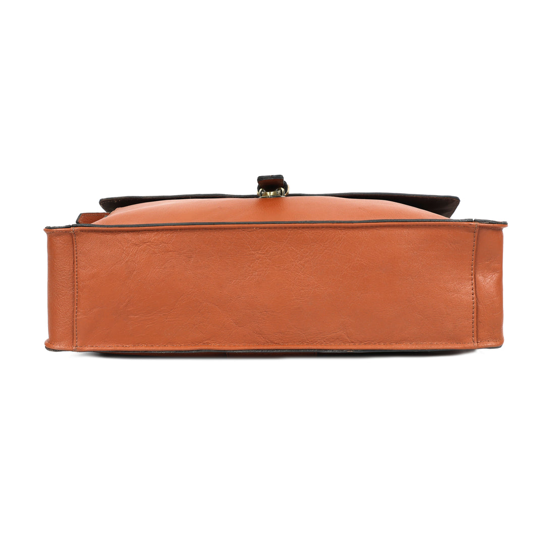 Brown leather handbag with a black strap on a white background