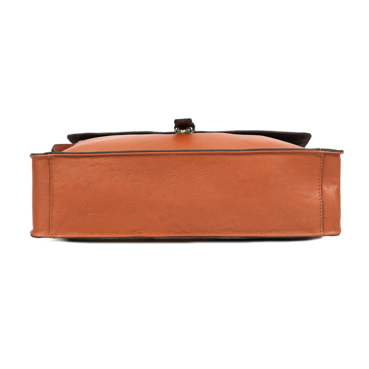Brown leather handbag with a black strap on a white background