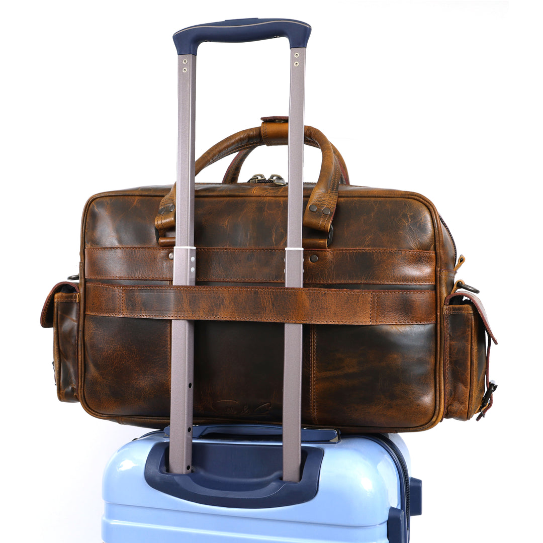 Brown leather suitcase on a white background