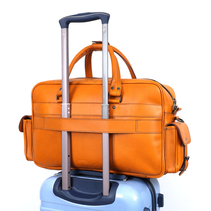 Orange suitcase with wheels on a white background