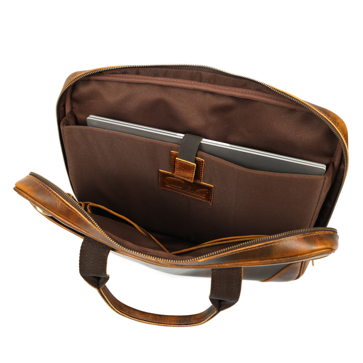 Brown leather briefcase with a laptop inside on a white background