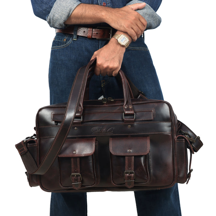 Man holding a brown leather briefcase against a white background
