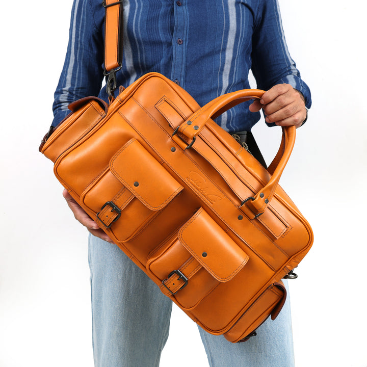 Person holding an orange leather briefcase against a white background