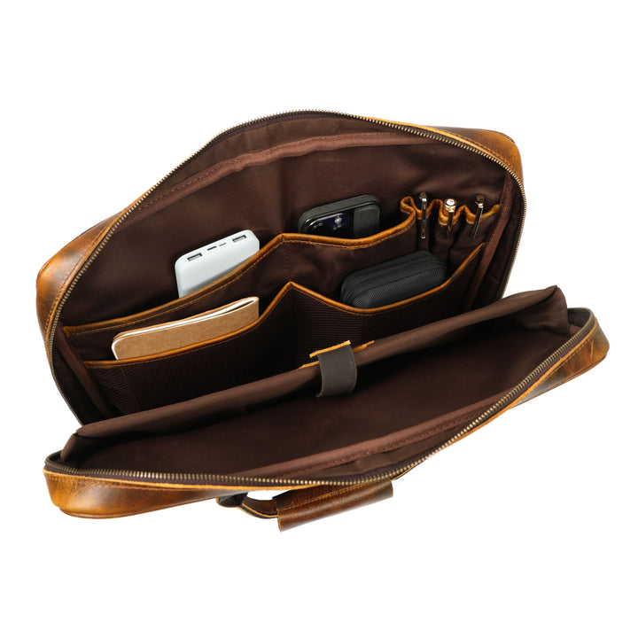 Brown leather briefcase with compartments on a white background