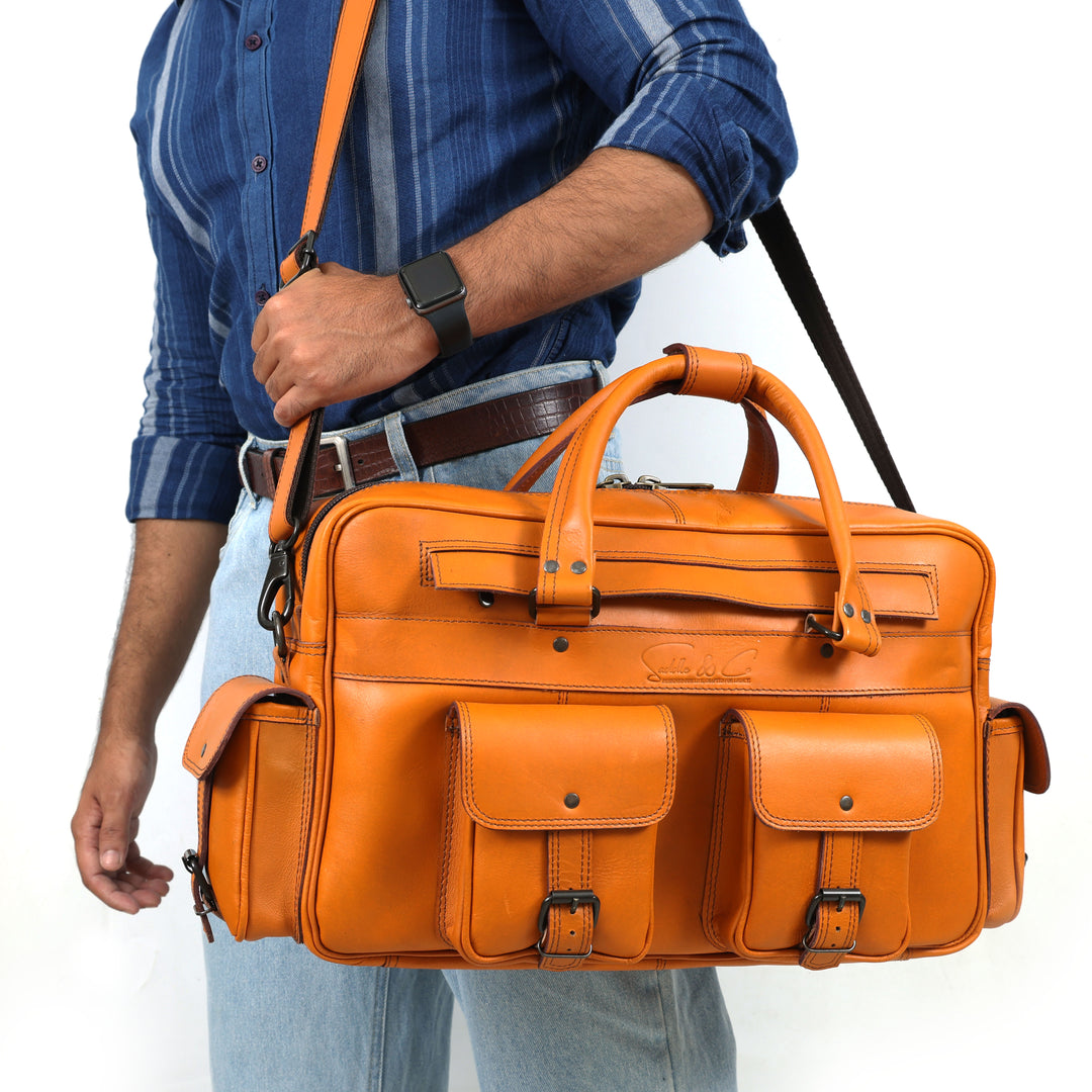 Person holding an orange leather briefcase with a white background