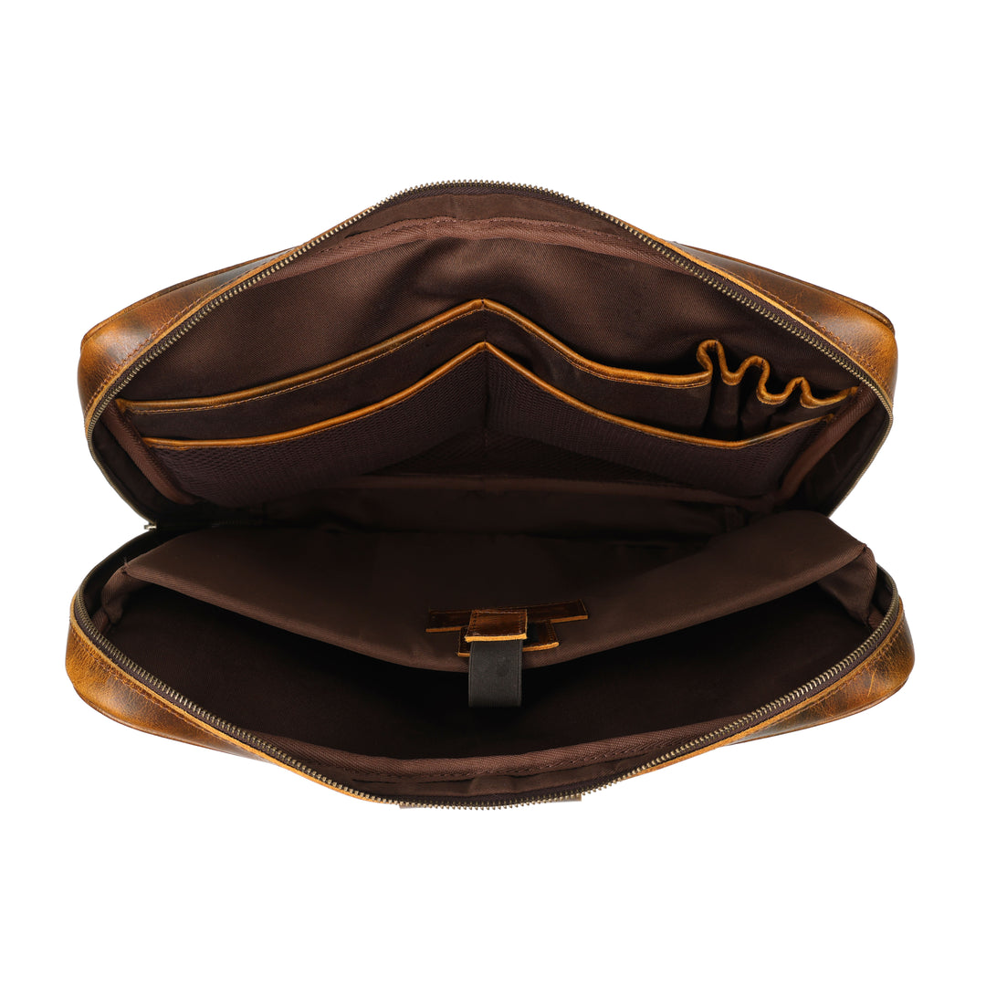 Brown leather bag with gold trim on a white background