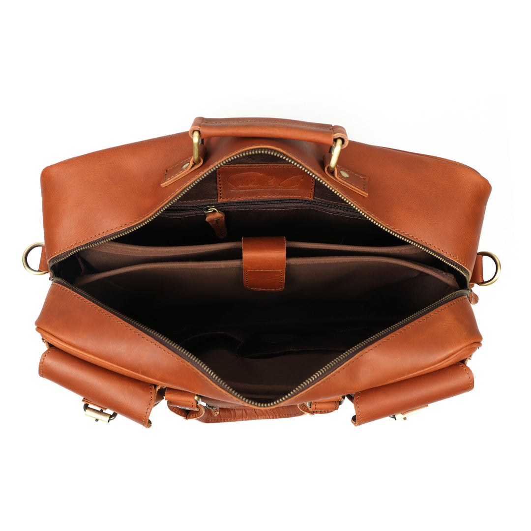 Brown leather bag with gold hardware on a white background