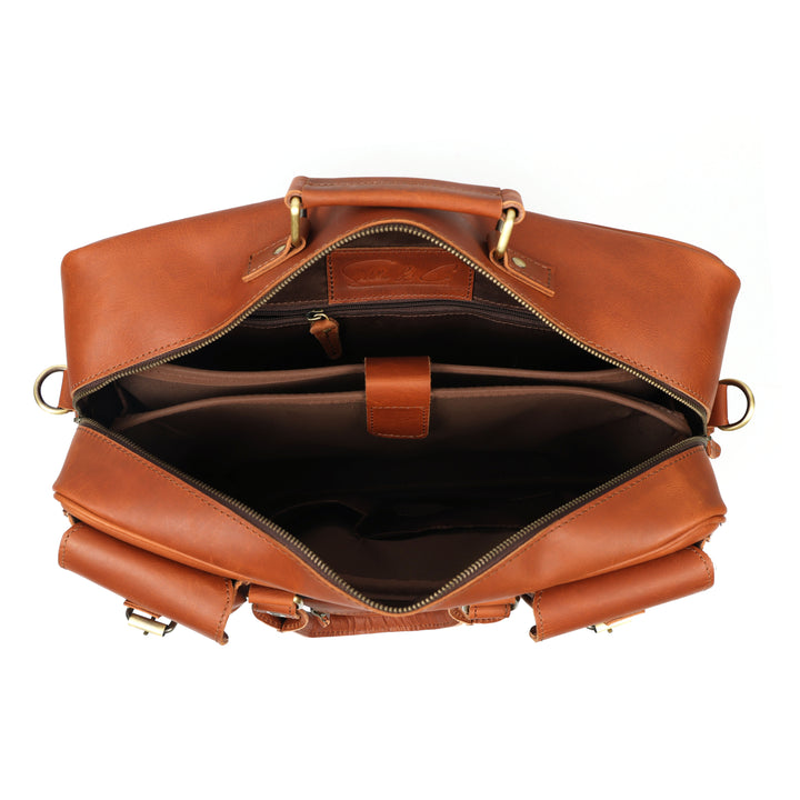 Brown leather bag with gold hardware on a white background