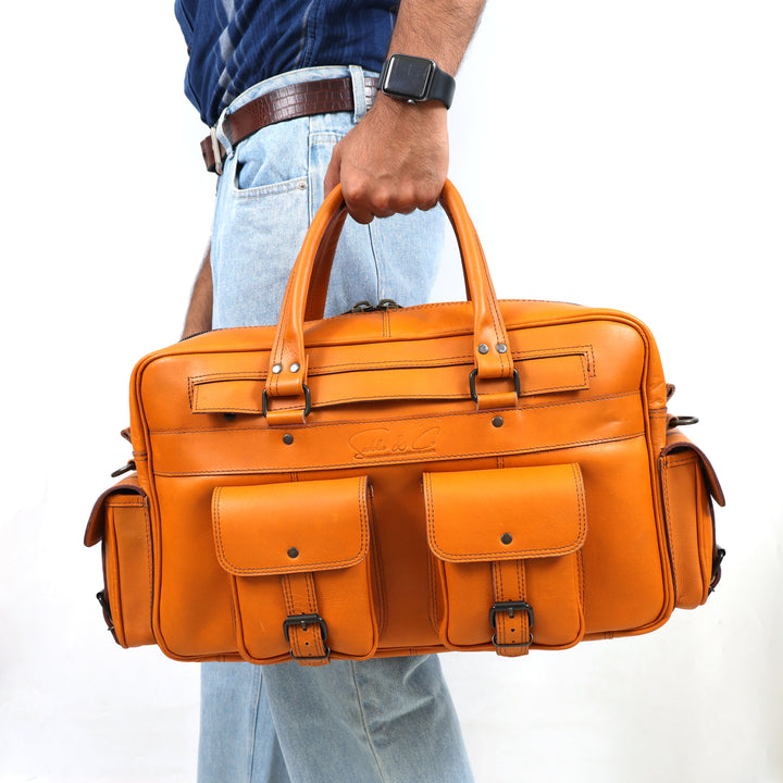 Orange leather briefcase held by a person on a white background